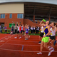 Runners chugging beer at starting line